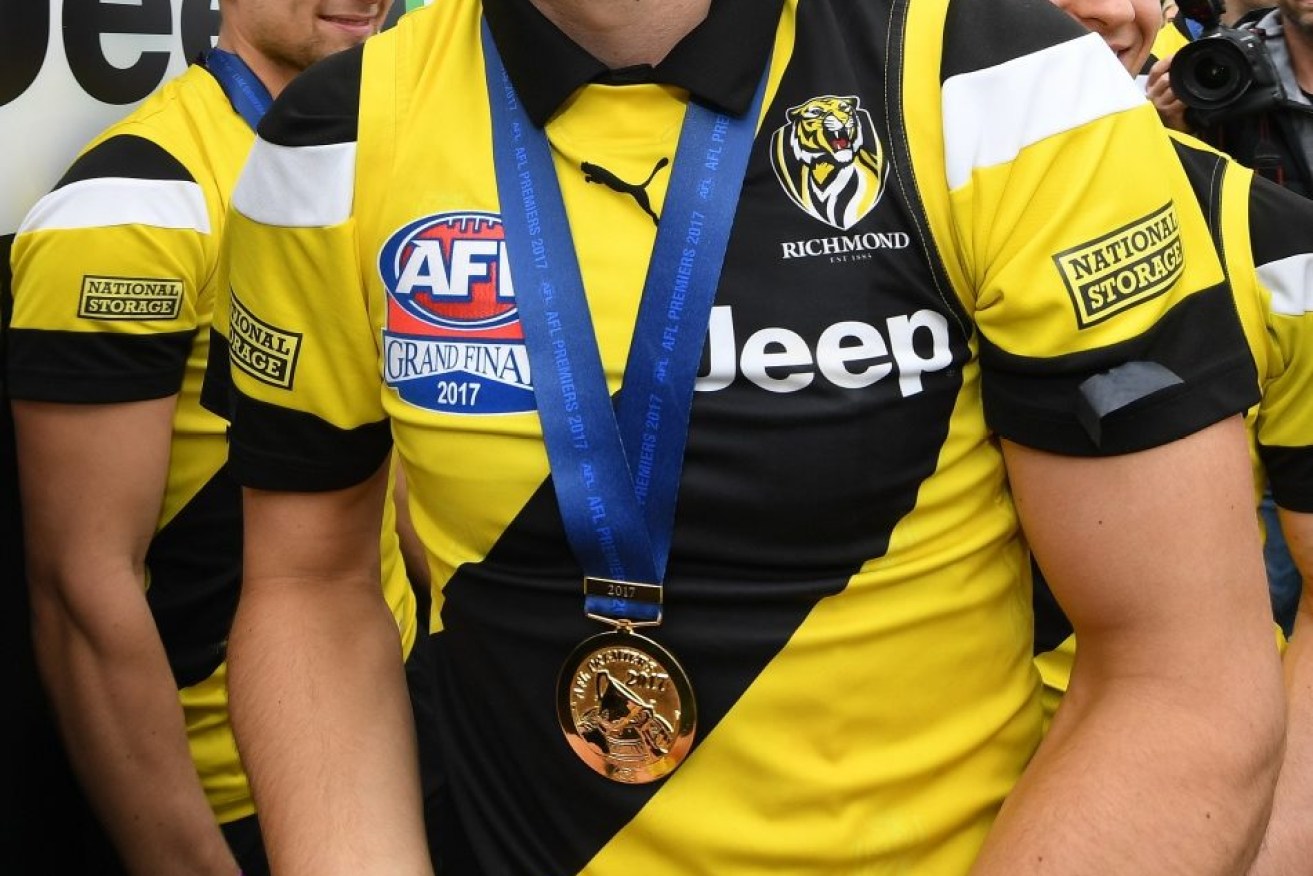 A Richmond footballer has become the centre of a topless photo scandal.