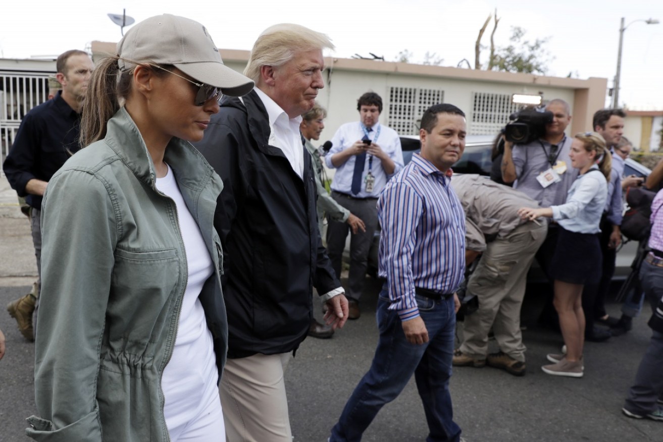 President Donald Trump and first lady Melania Trump take a walking tour to survey hurricane damage and recovery efforts in Puerto Rico.