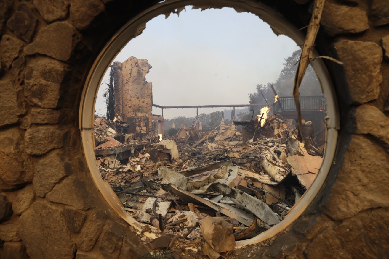 The fire-ravaged Signorello Estate winery is seen through a circular window.