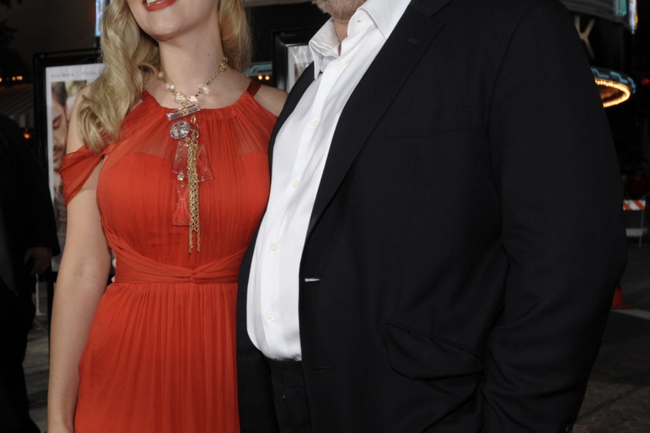 Harvey Weinstein poses with actress Scarlett Johansson at a movie premiere in Los Angeles.