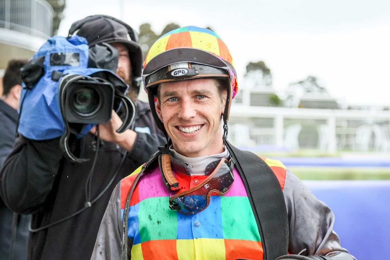 Jockey Chris Symons tries to improve his odds with a pre-race superstition