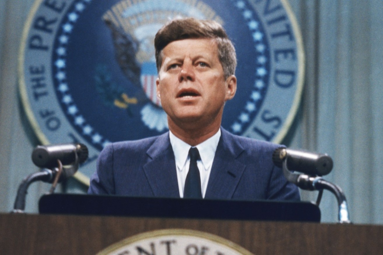 John F Kennedy was shot and killed while riding in his motorcade through Dallas in 1963.