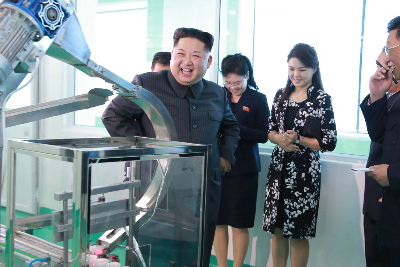 Kim Jong-un's wife (R) joined the supreme leader on a tour of a North Korean cosmetic factory.