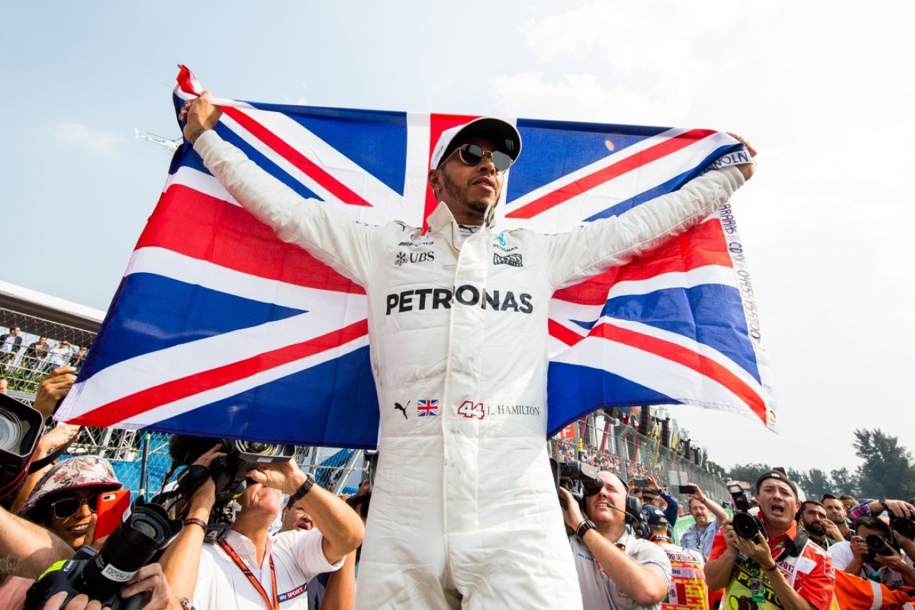 Britain's Lewis Hamilton has clinched the Formula One world title at the Mexican Grand Prix, which was won by Max Verstappen.