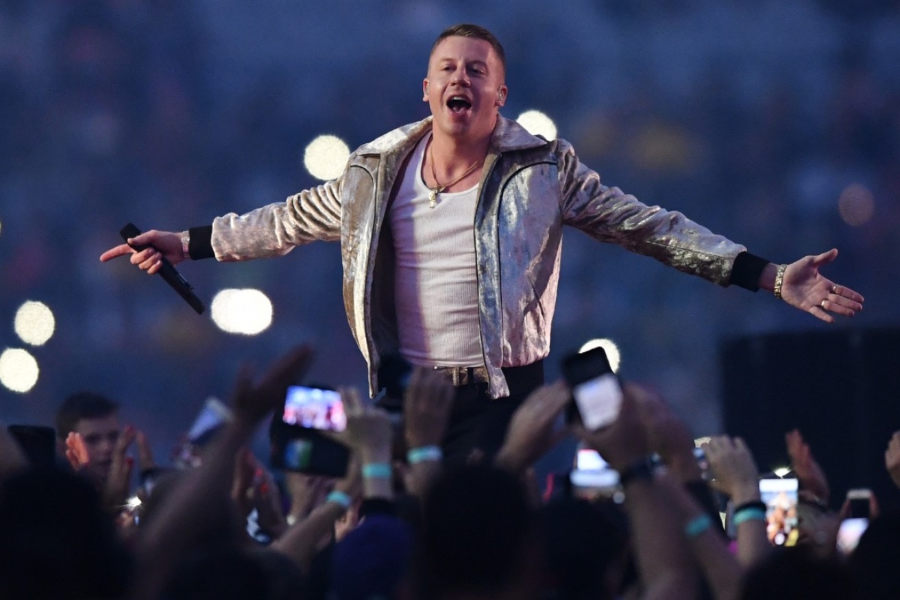 Macklemore performs before the NRL grand final.