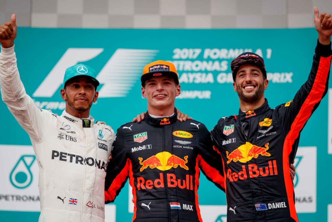 Race winner Max Verstappen with second-placed Lewis Hamilton and third-placed Daniel Ricciardo
