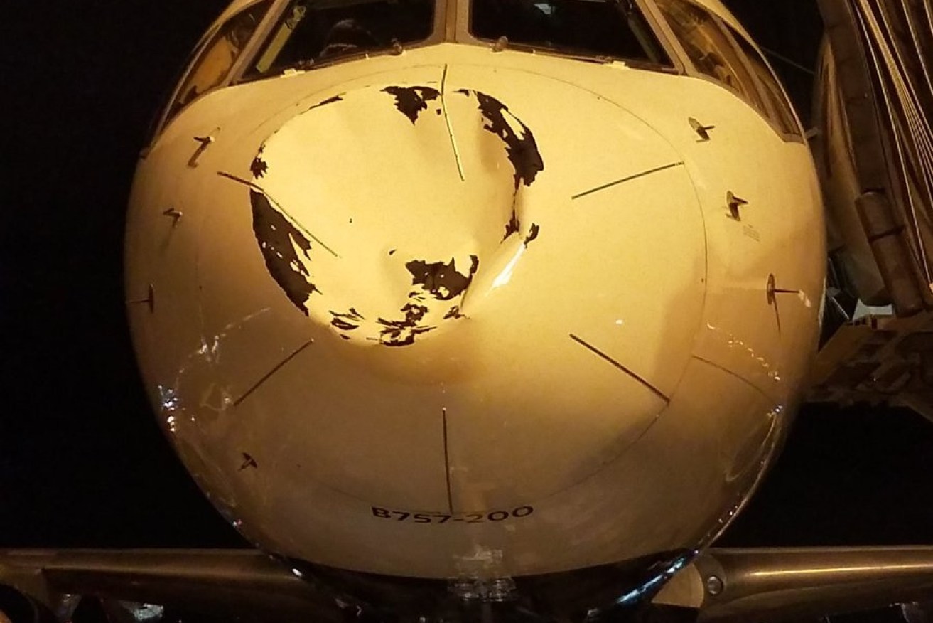 The damaged plane after it arrived in Chicago.