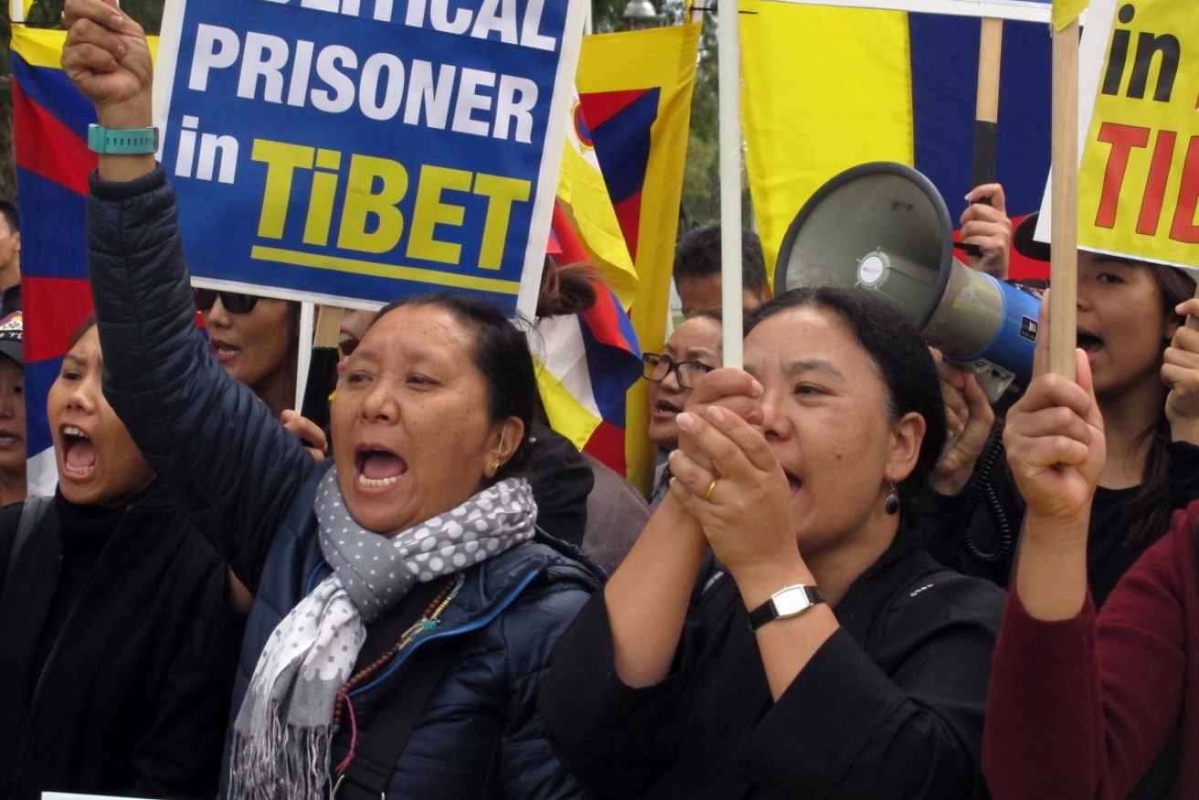 Free Tibet protesters demonstrate outside Parliament House in 2017. Photo: AAP