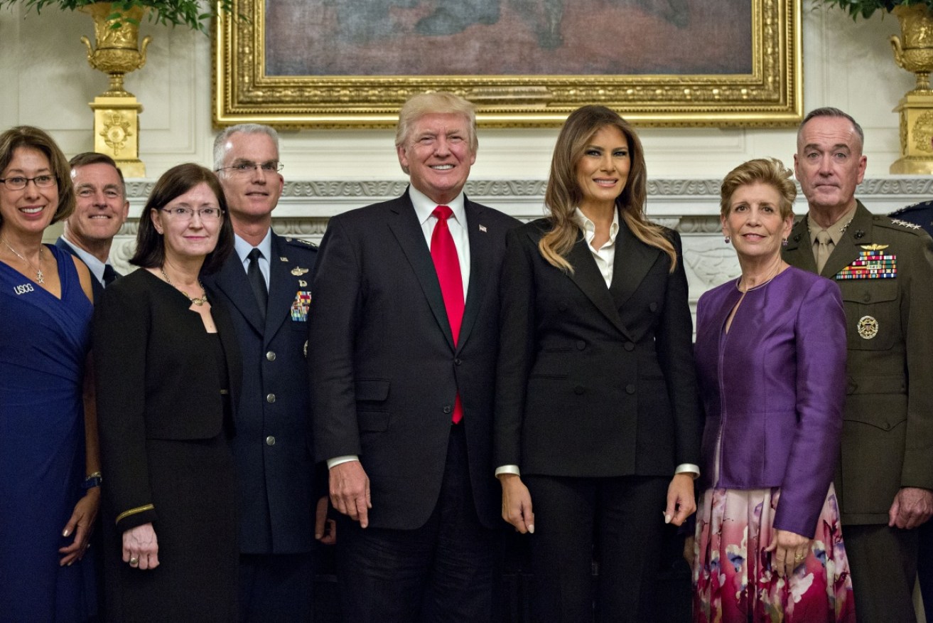 Trump (with wife Melania, various generals and guests) said the White House gathering was "the calm before the storm"
