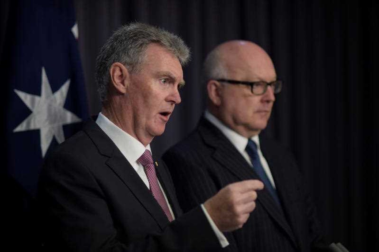 Director general of security and head of ASIO Duncan Lewis and Australian Attorney-General George Brandis.