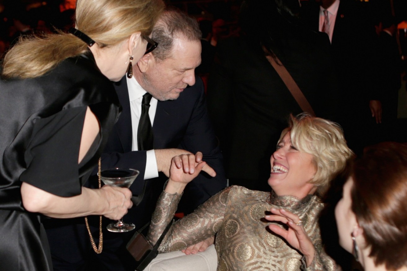 Emma Thompson interacts with Harvey Weinstein at the Weinstein Company's Golden Globes after party in 2014.