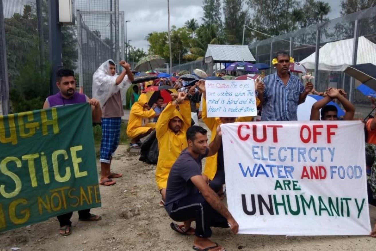 Refugees and asylum seekers at Australia's processing centre at Manus Island are pictured during a peaceful protest on Monday.