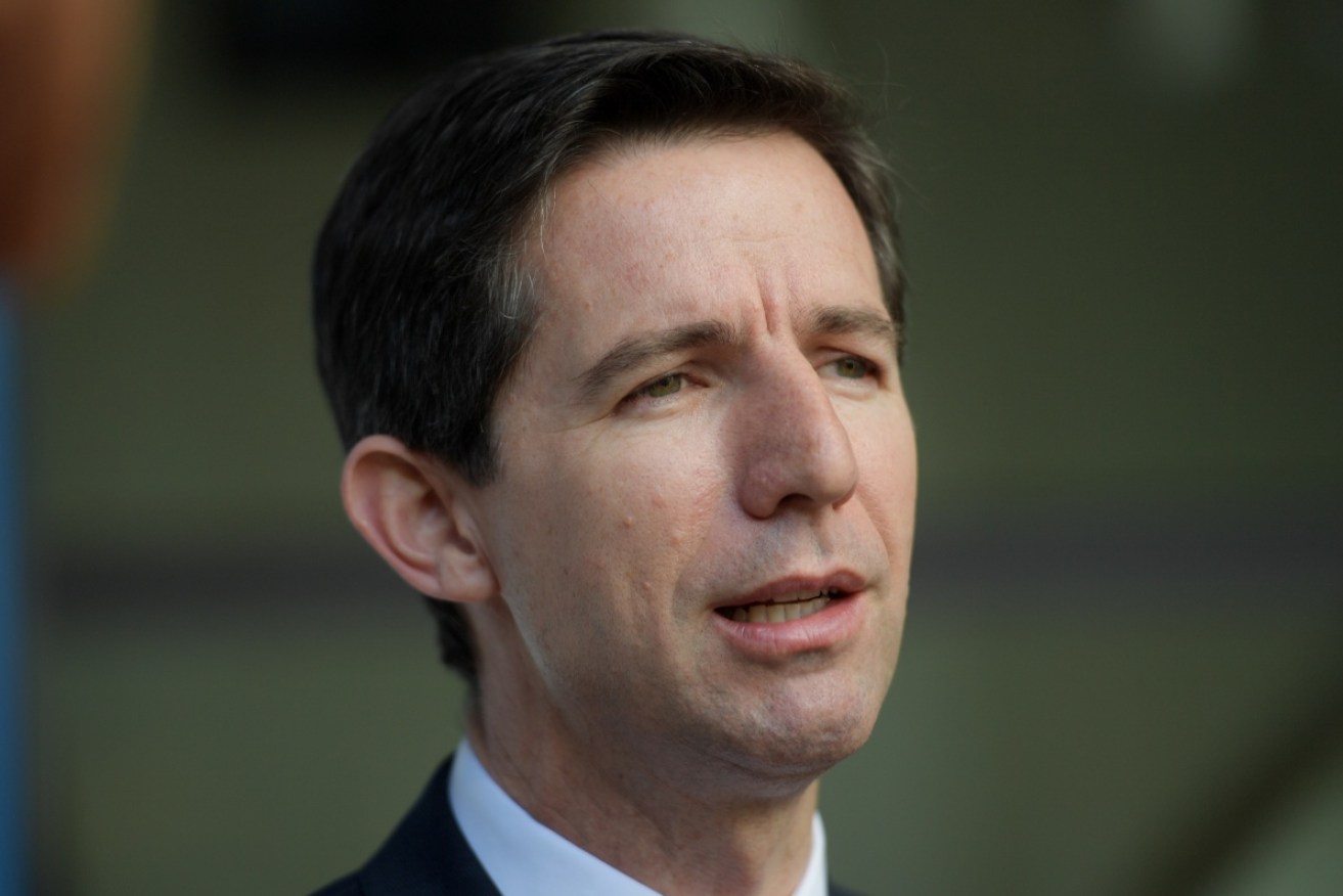 Simon Birmingham said financial support will taper once 80 per cent double-dose targets are met.