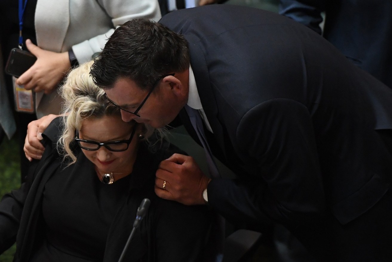 Victorian Premier Daniel Andrews (right) embraces health minister Jill Hennessy after the Victoria assisted dying bill passed.
