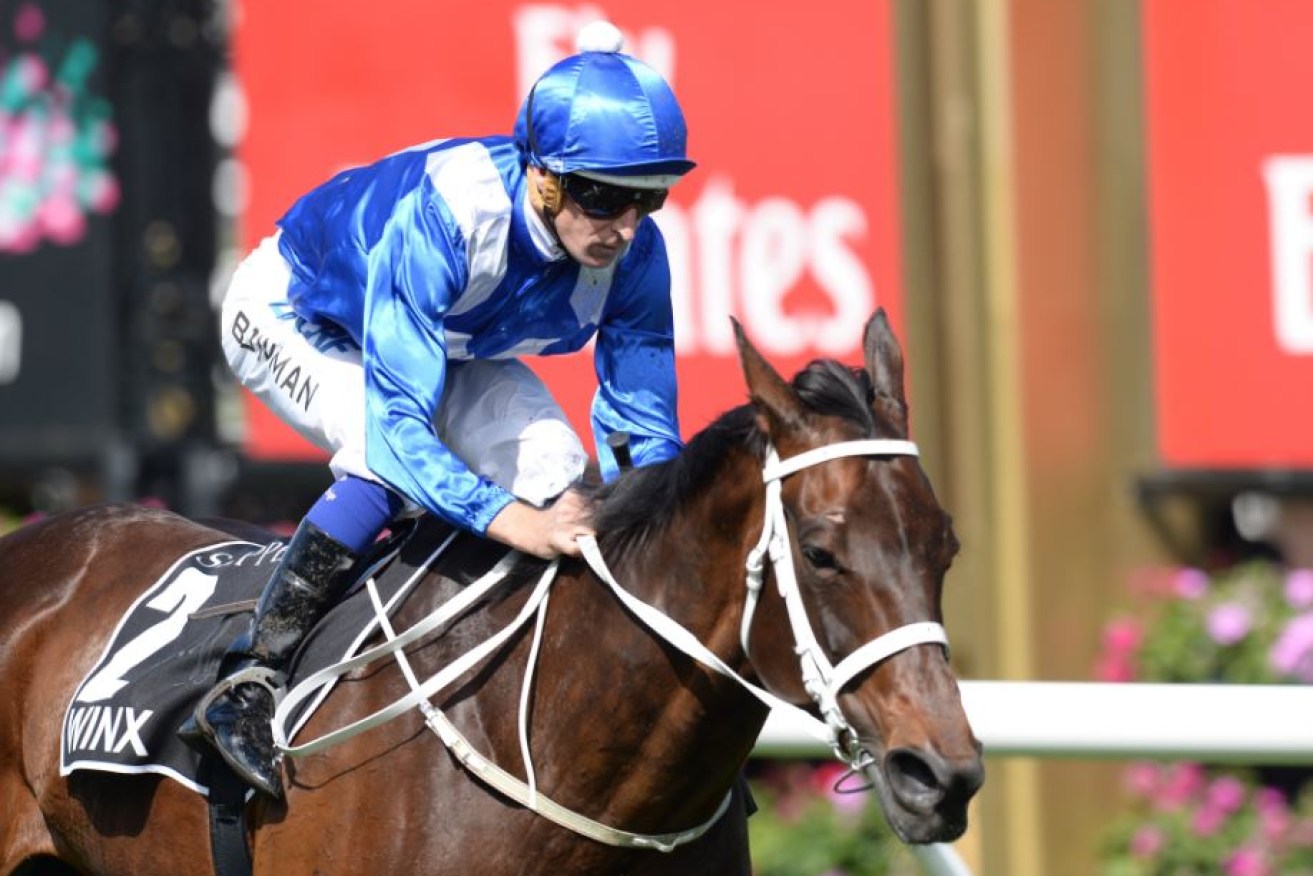 Hugh Bowman guides Winx to an easy six-length win in the Turnbull Stakes, her incredible 21st triumph in a row.