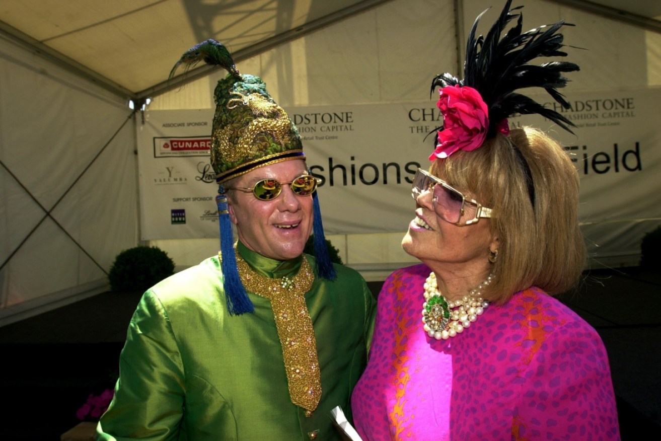 Socialite Lillian Frank (right) and fashion designer Peter Jago at the races in 2000. <i>Photo: AAP</i>