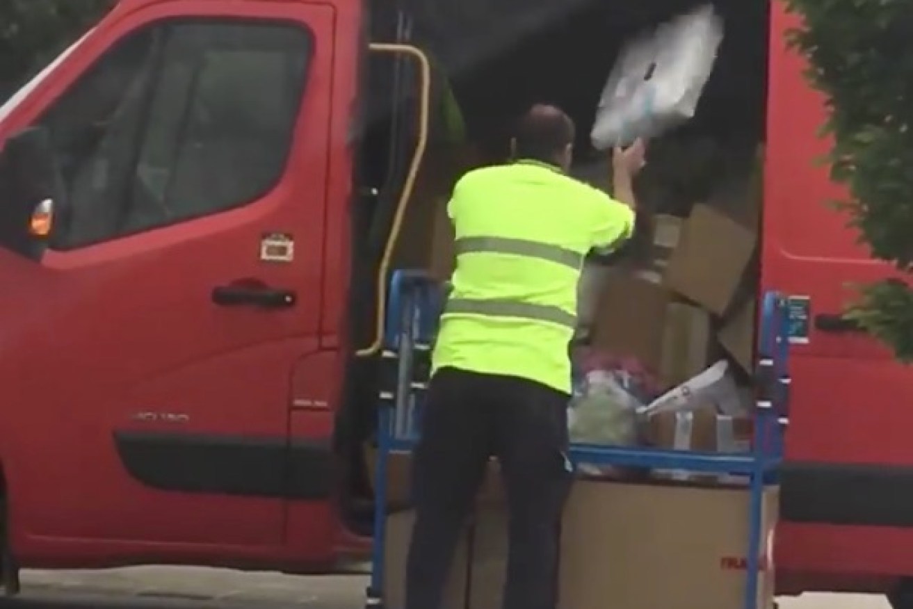 Australia Post are investigating an incident of a postman throwing parcels.