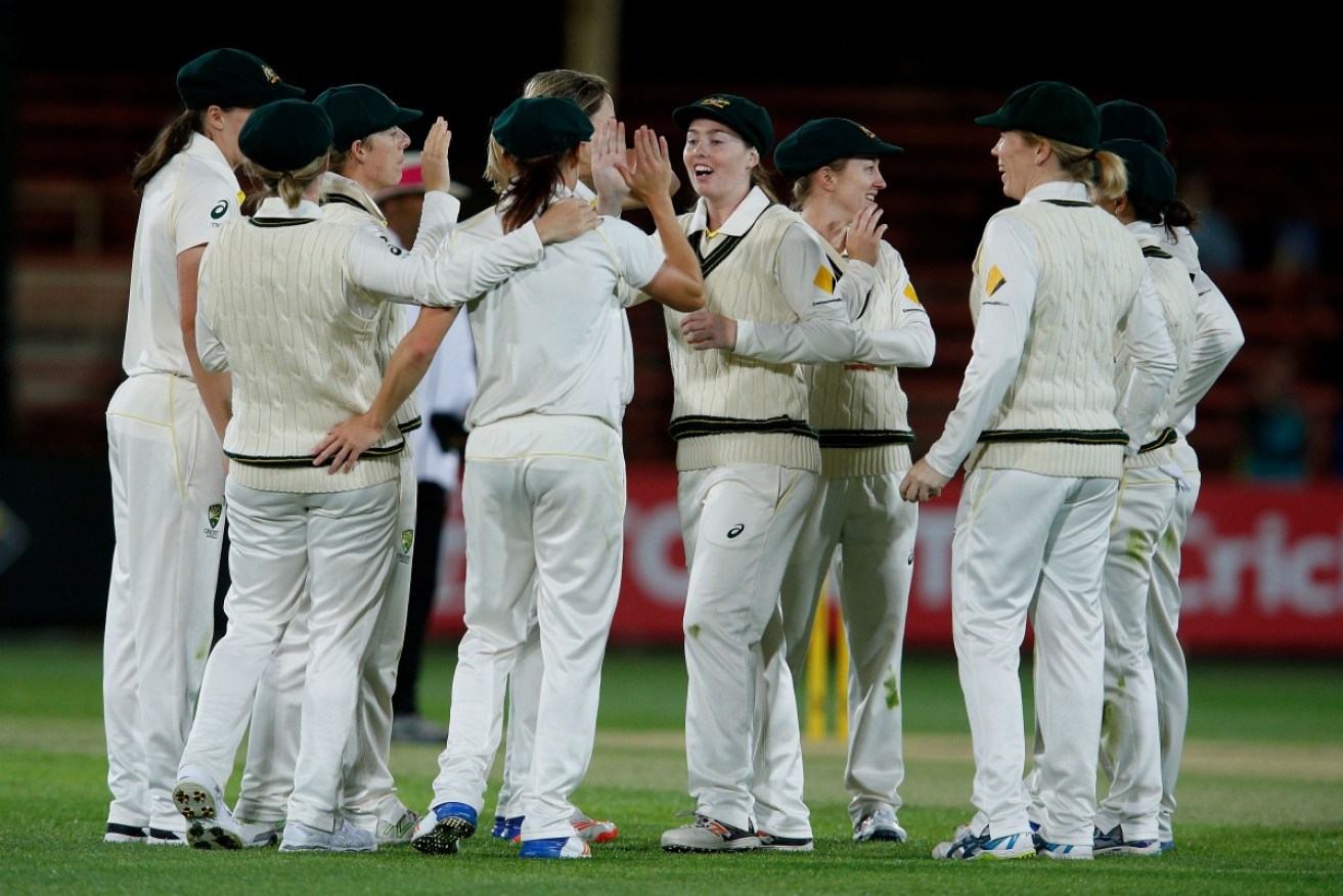 Australia celebrate the wicket of Georgia Elwiss during the opening day of the Test.