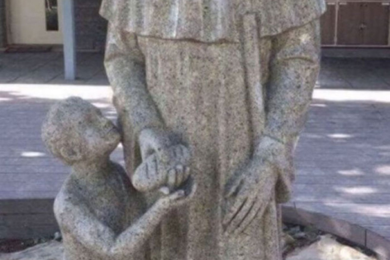 The statue depicts Dominican brother St Martin de Porres.