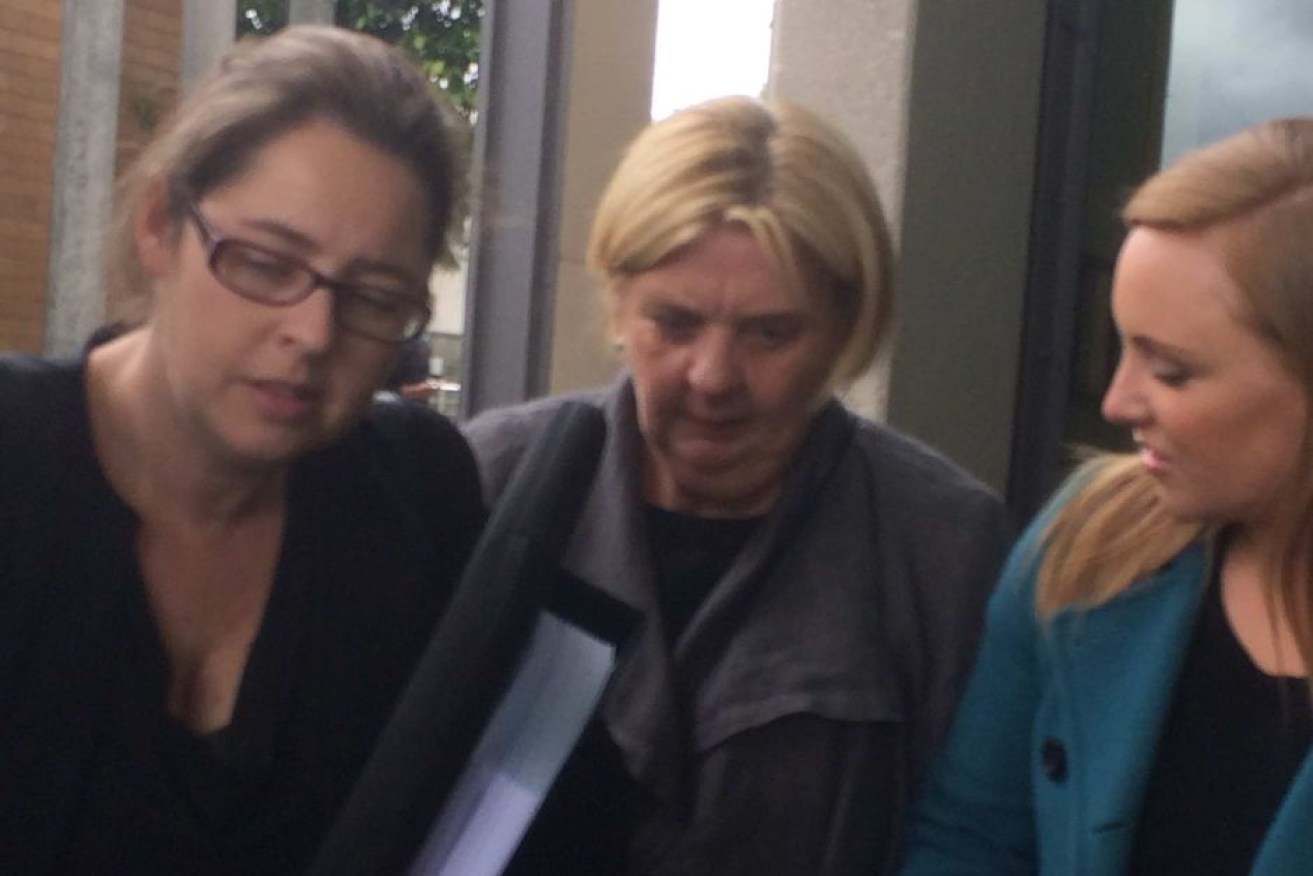Former legal clerk Cheryle Rowe (C) outside the Latrobe Valley Magistrates Court in 2016.