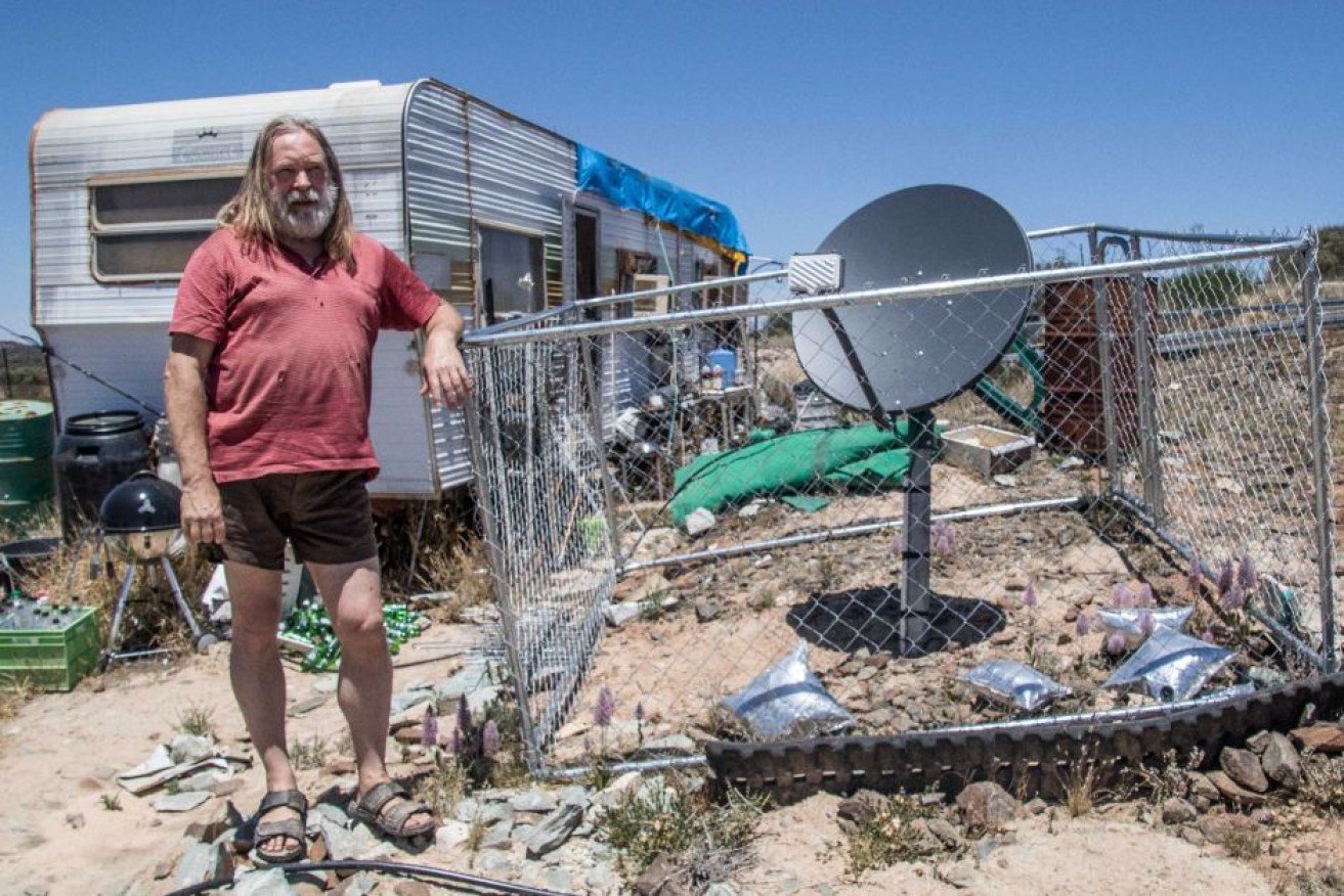 Roland Gopel is being threatened with fines of $50 a day for living in a caravan on land he owns.
