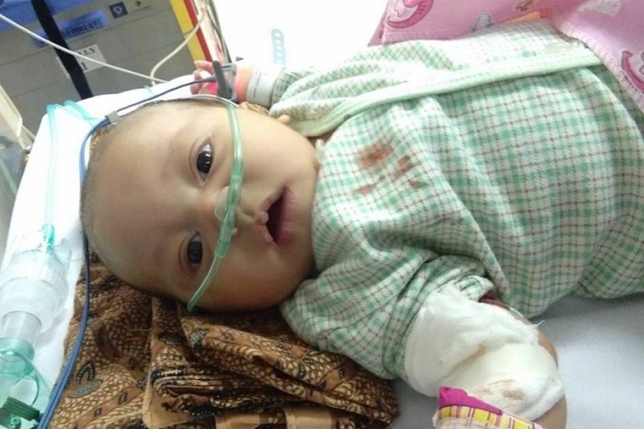 Baby Muhammad Hafizh's parents believe cigarette smoke caused a rapid decline in his health.