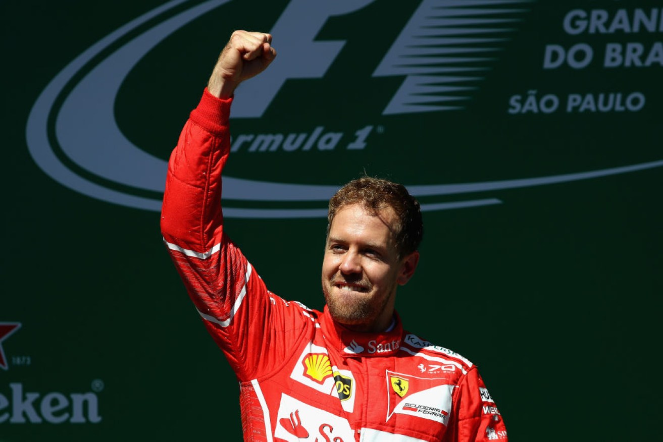 Sebastian Vettel of Germany and Ferrari celebrates celebrates his win at the Brazilian Grand Prix.