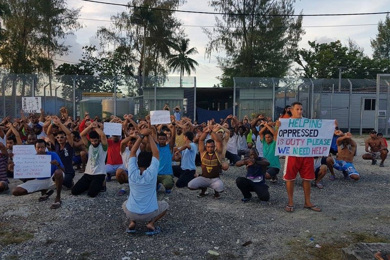 Refugees and asylum seekers protest at the decommissioned Manus Island detention centre before their forced removal last week.