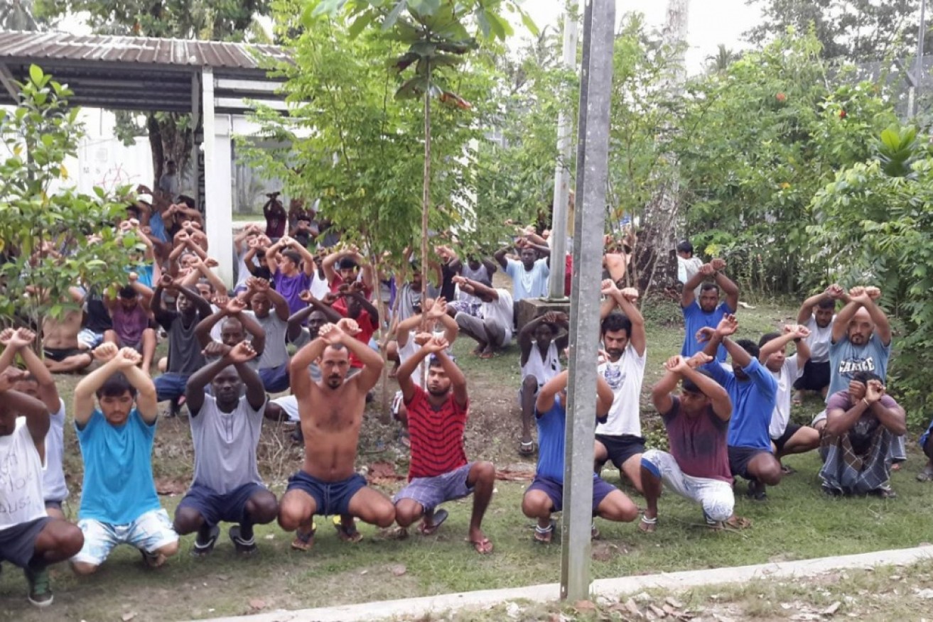 Refugees and asylum seekers are pictured protesting at the now decommissioned Manus Island detention centre.