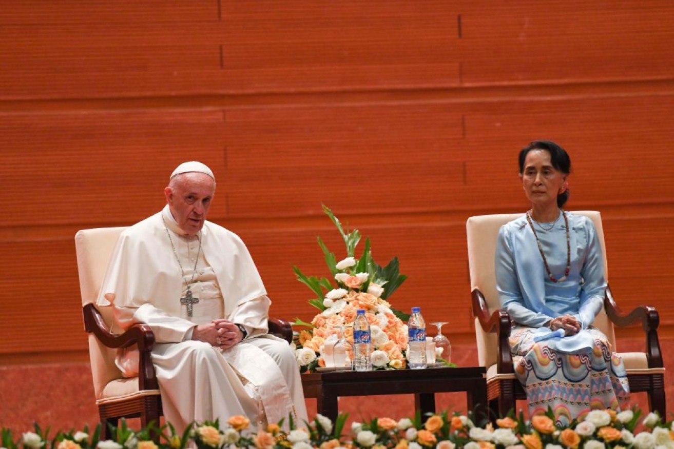 Pope Francis sits next to Myanmar's civilian leader Aung San Suu Kyi in Myanmar on Tuesday.