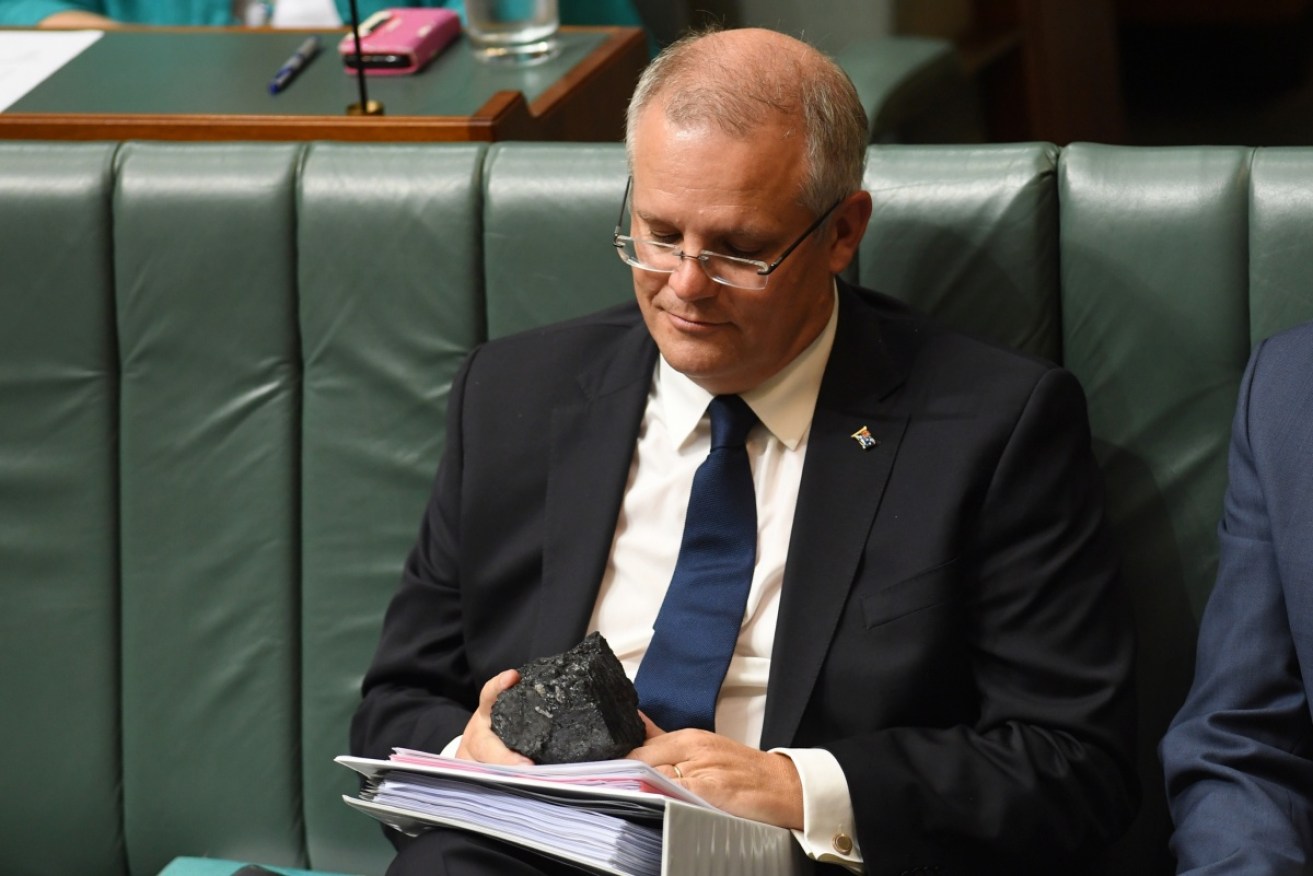 Scott Morrison looks longingly at a lump of coal in Parliament in February, 2017.