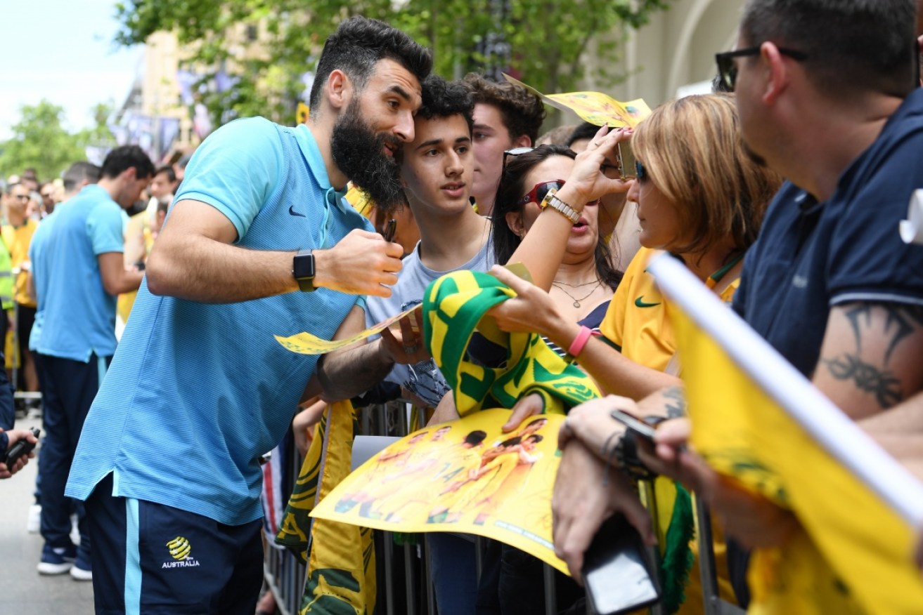 Socceroos' captain Mile Jedinak with fans in Martin Place.