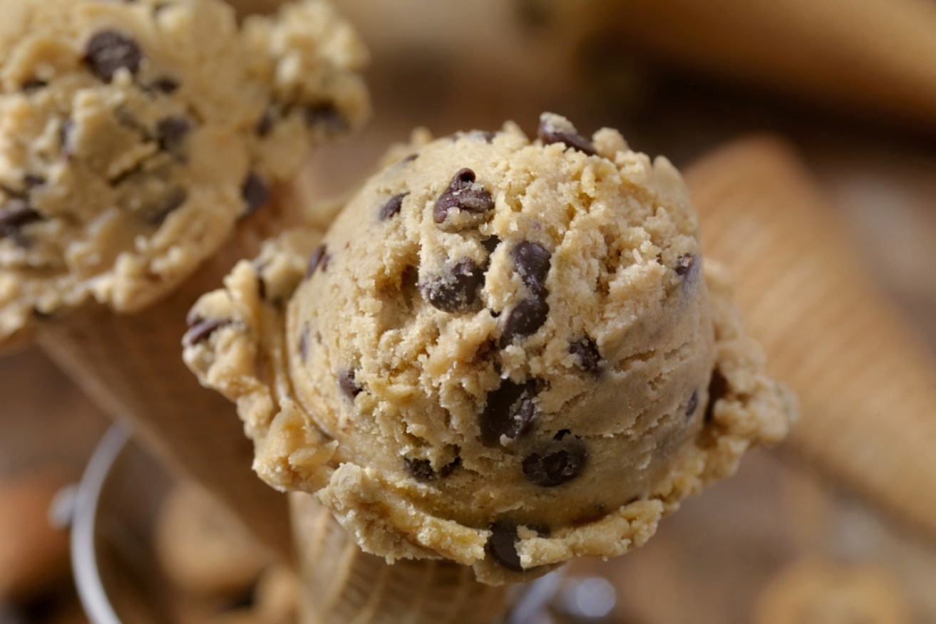 Experts say because it has no crunch, eating cookie dough is less satisfying than cooked biscuits.