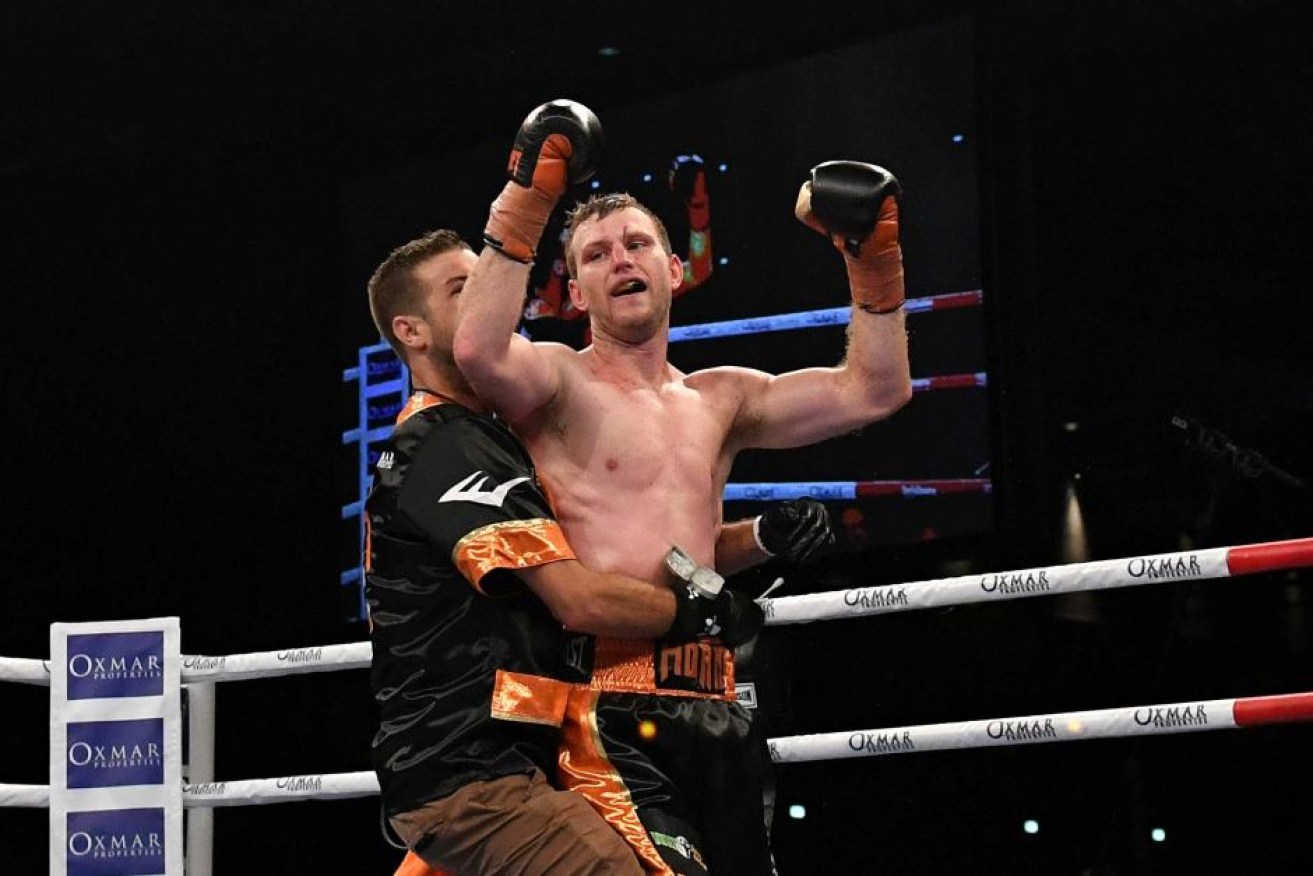 Jeff Horn celebrates defending his welterweight title.