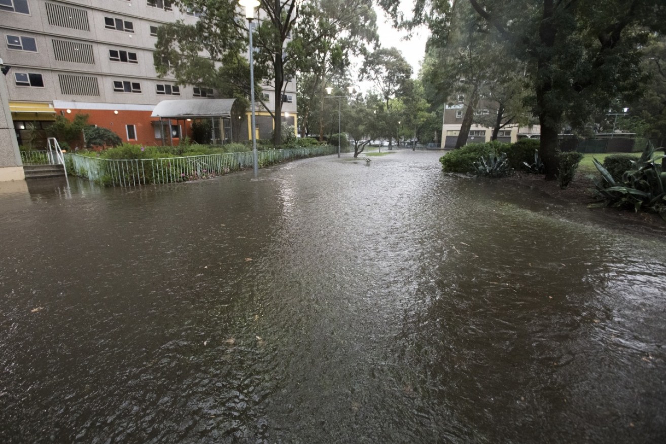 The corner of Buncle Street and Alfred Street in North Melbourne is covered in water after Tuesday's flash flooding.
