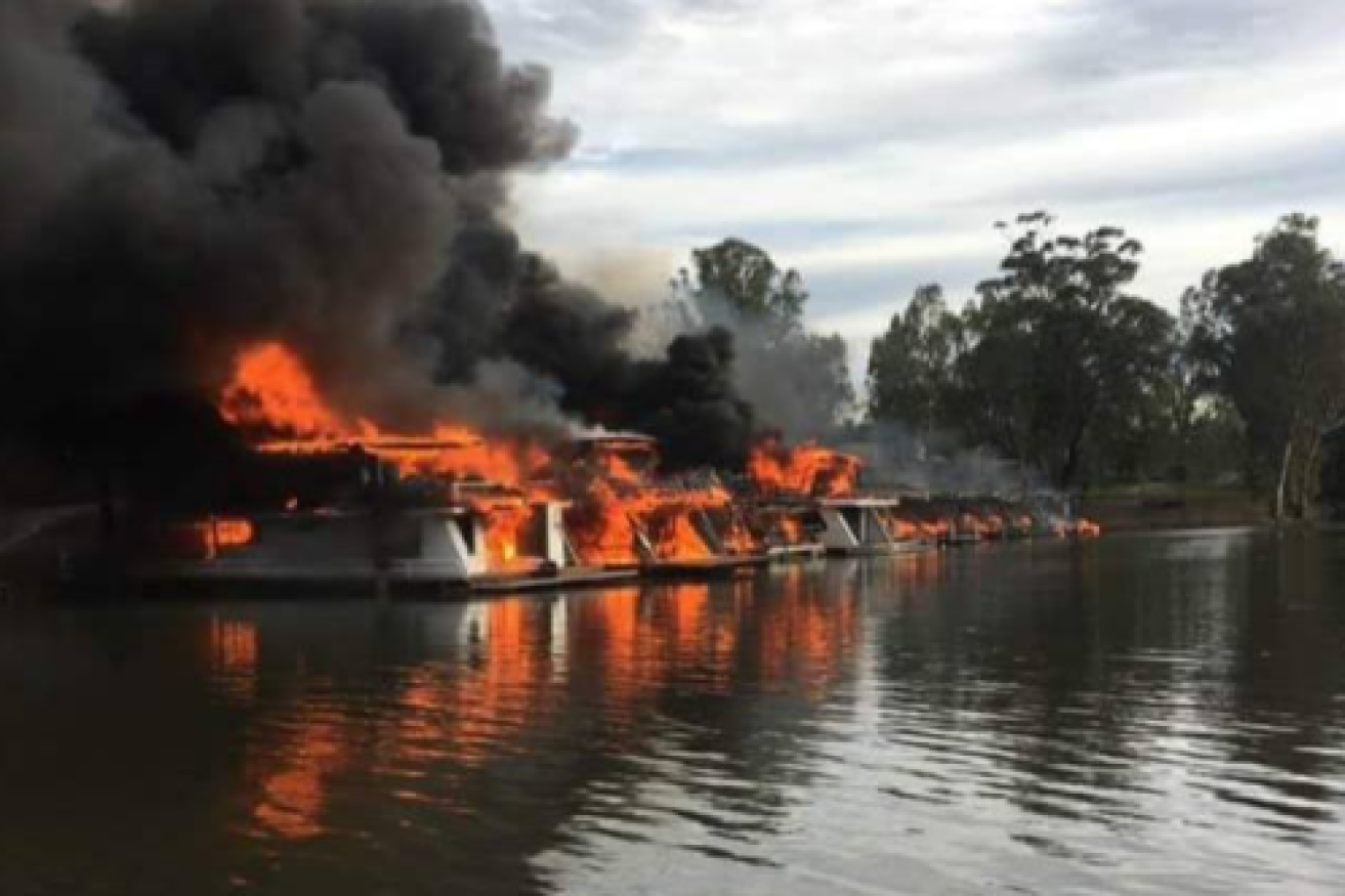 At least 15 houseboats were moored at the marina when fire ripped through them. 
