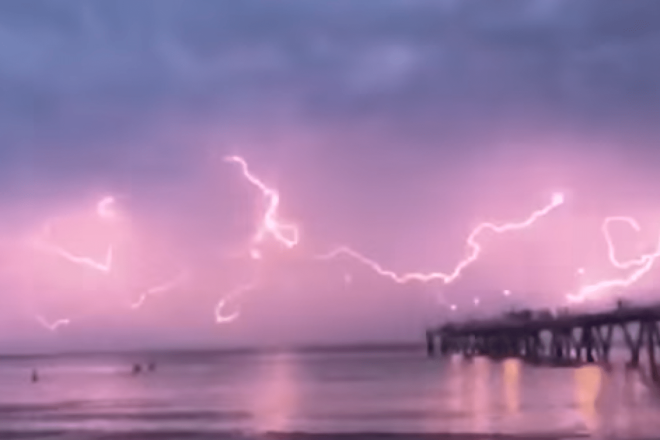 'Spider lightning' illuminates seaside Adelaide with spectacular light show.
