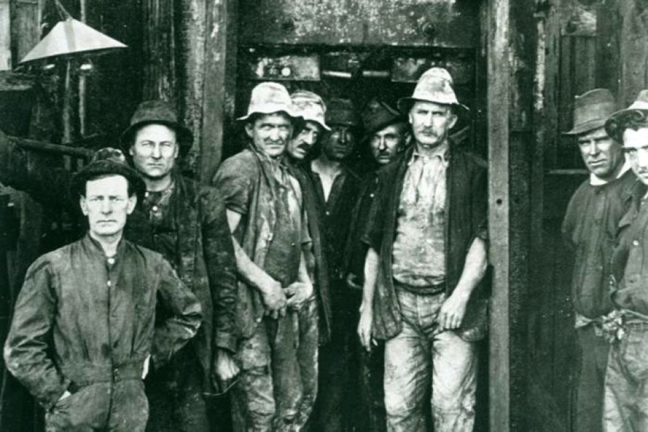 Engineer W.R.H. Melville with some of the miners who worked on the tunnel.
