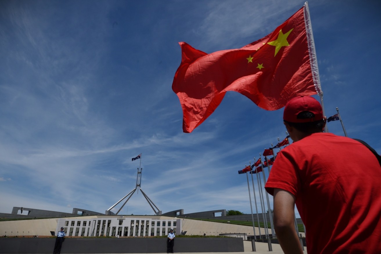 Australia's ambassador to China has reportedly been summoned by Chinese officials as a diplomatic row intensifies over new foreign interference laws.