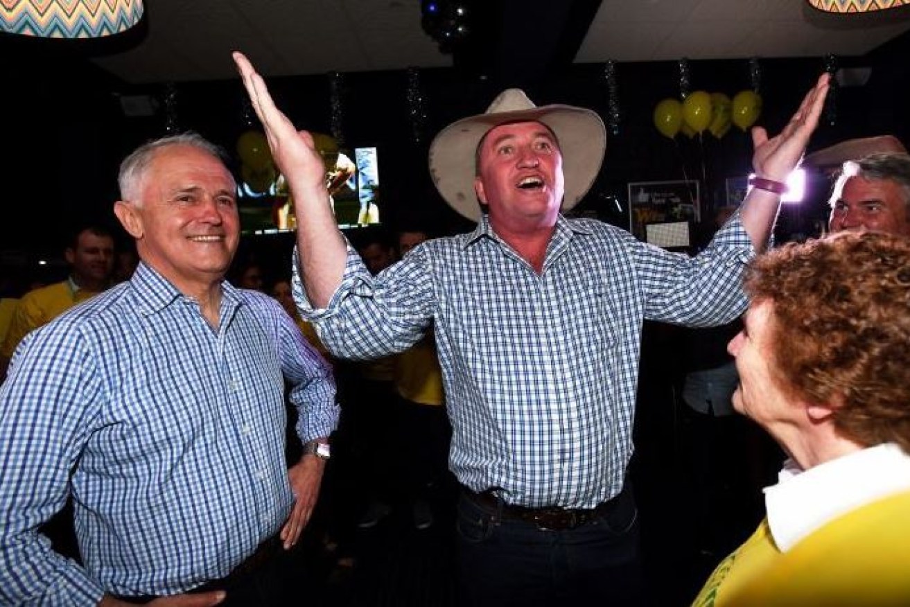 Barnaby Joyce celebrates his victory with Prime Minister Malcolm Turnbull.