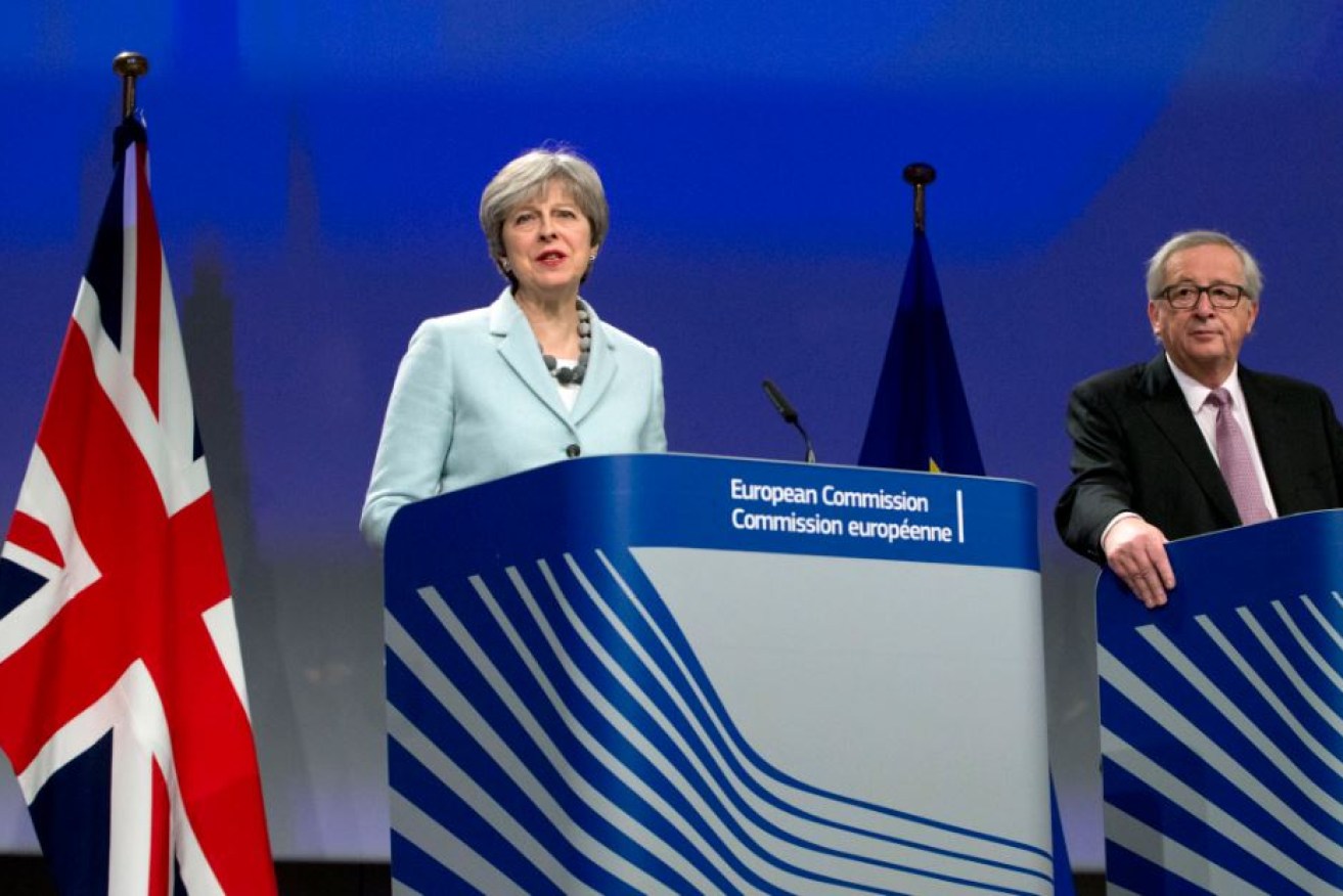 Prime Minister Theresa May hails the first stage of the Brexit agreement negotiated with European Commission President Jean-Claude Juncker.