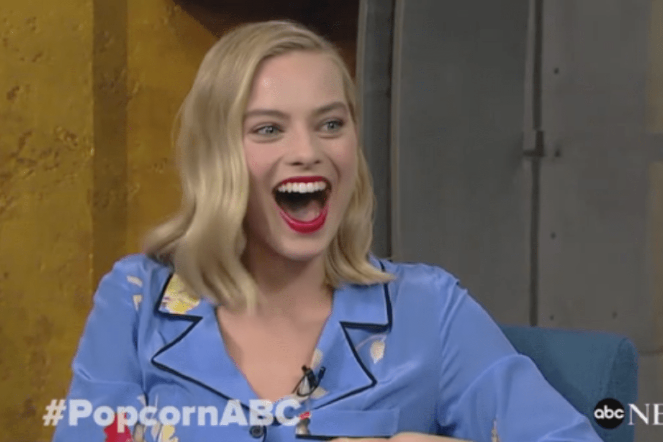 A stunned Margot Robbie learned of her latest accolade while the cameras were rolling.