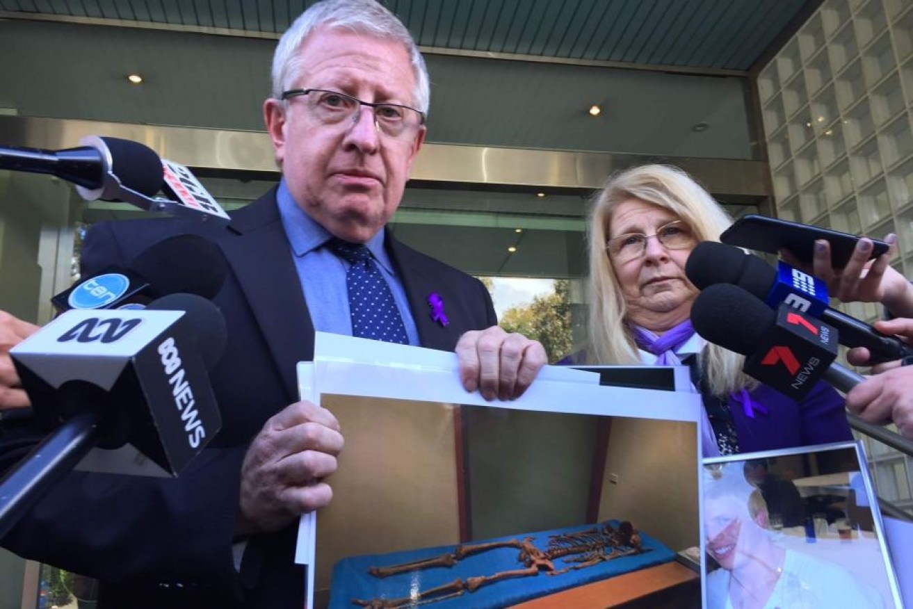 Mark and Faye Leveson with a picture of the remains of their son in 2017.