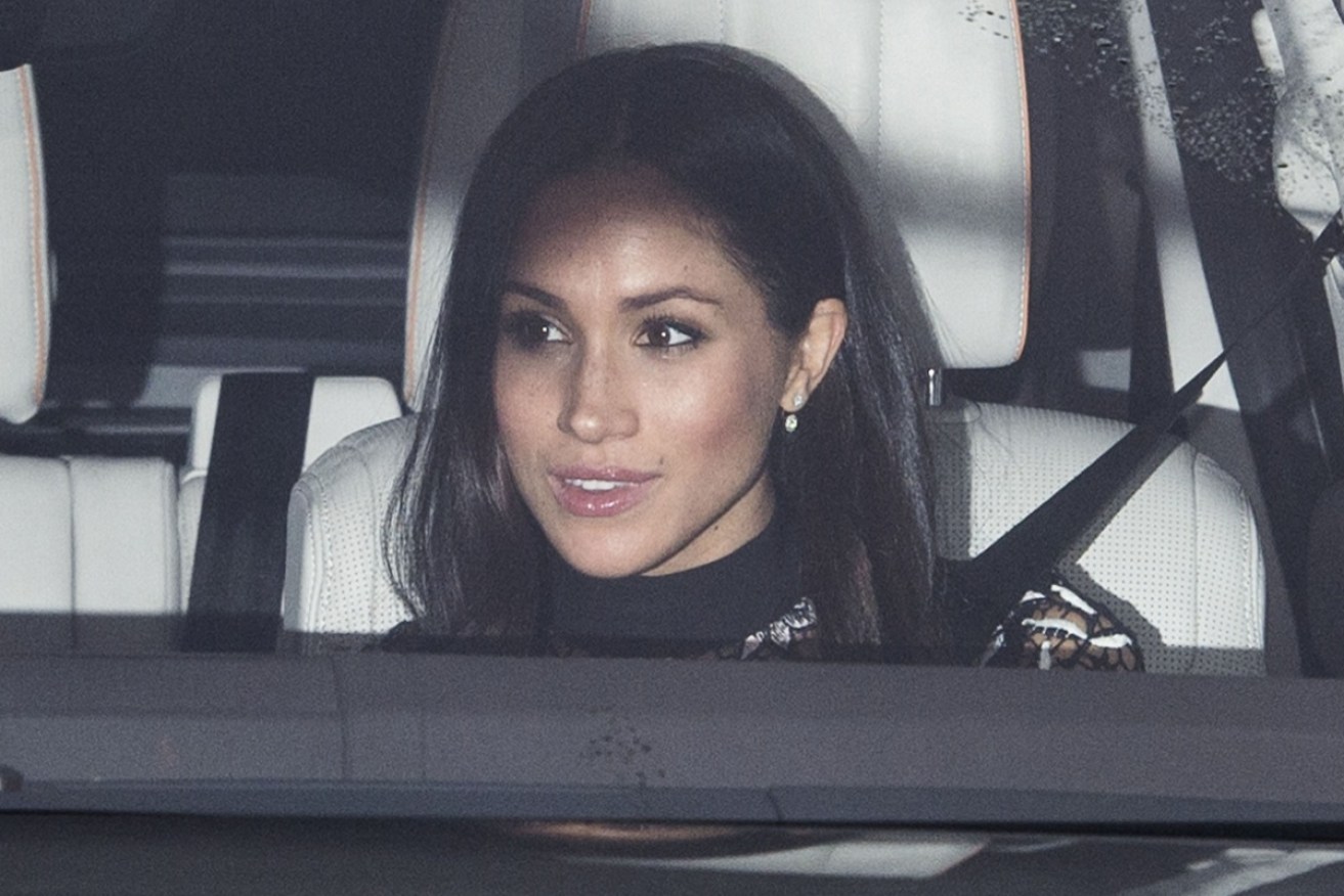 Prince Harry's fiance fiancé Meghan Markle arriving at the Christmas banquet at Buckingham Palace.
