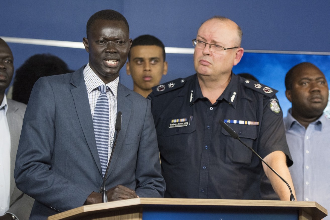 African community leader Kot Monoah   and Victorian Chief Police Commissioner Graham Ashton tackle the issue of youth crime head on at a media conference on Wednesday. 