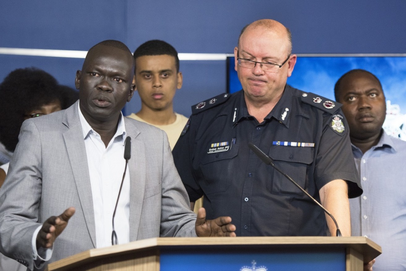 African-Australian community leader Deng pleads for tolerance and respect with VicPol's then-chief commissioner Graham Ashton. <i>Photo: AAP</i>