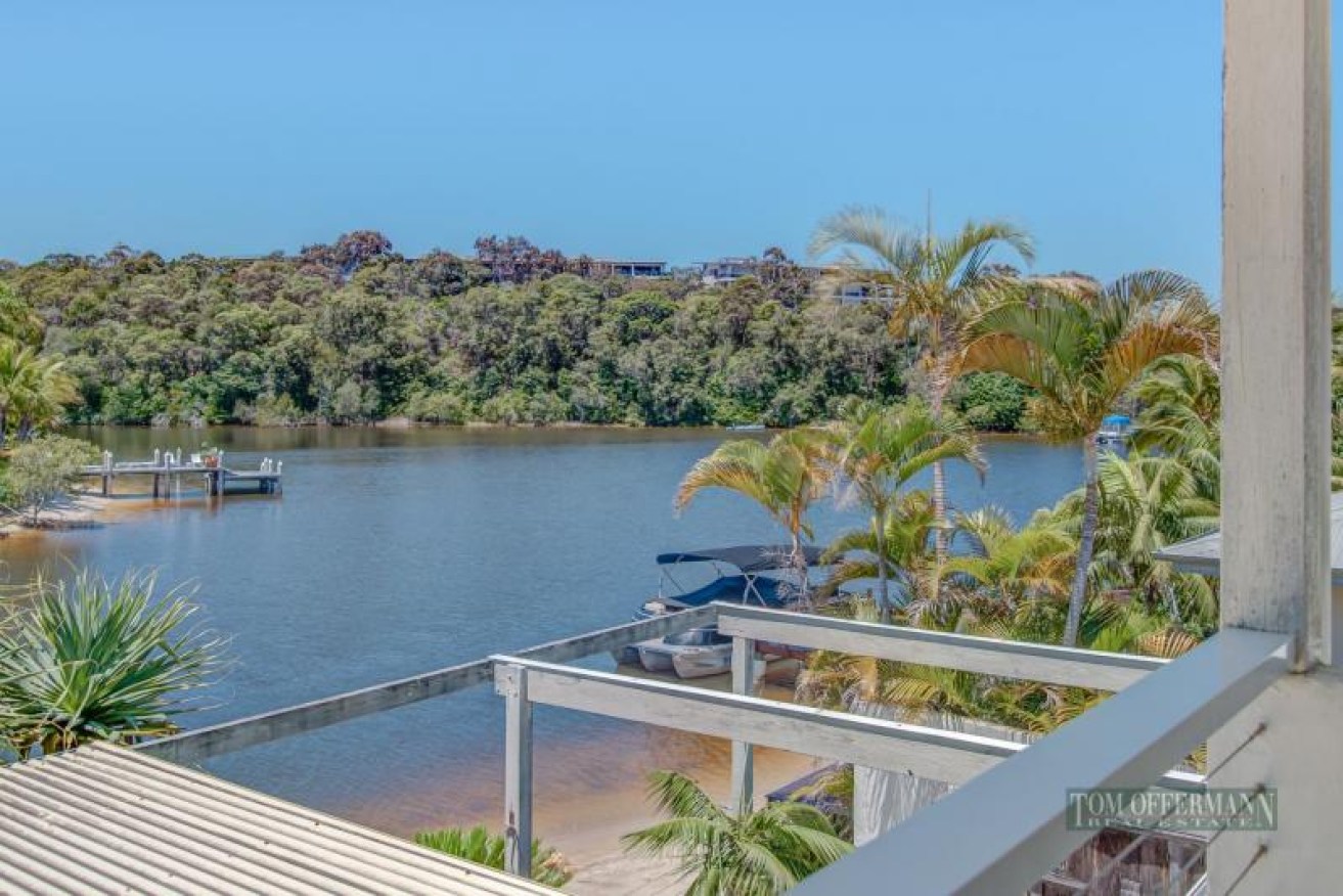 23 Cooran Court, Noosa Heads, not only has its own boat mooring but also its own beach.