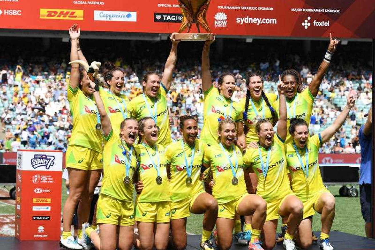 Australia poses for a photograph with the trophy after winning the women's Cup final against New Zealand.