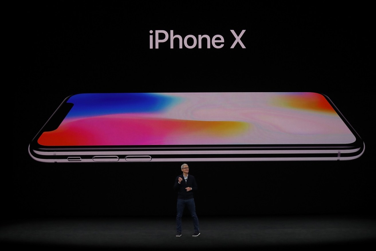 CEO Tim Cook unveiling the iPhone X
