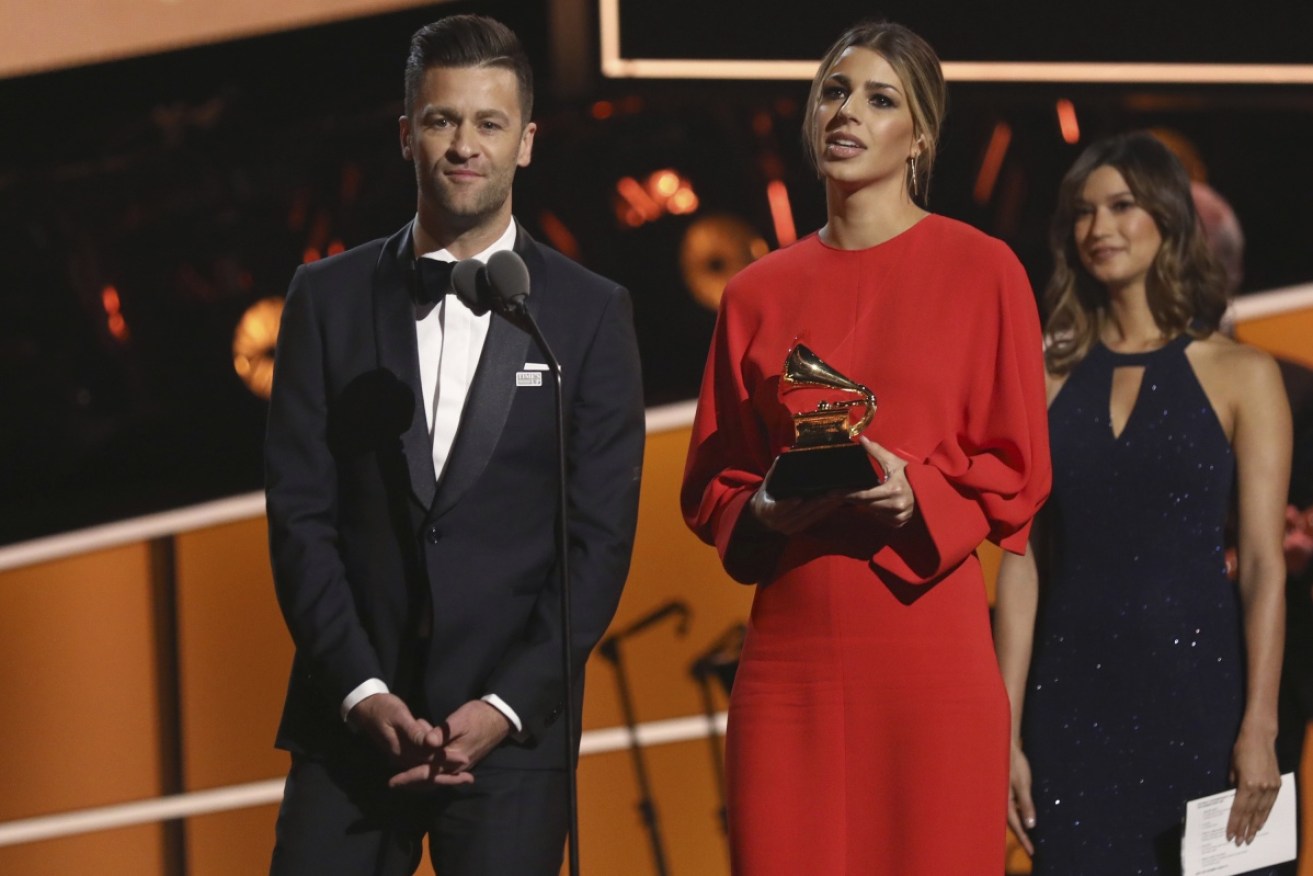 Ben Fielding, left, and Brooke Ligertwood, of Hillsong Worship, accept the Best Contemporary Christian Music Performance/Song award.
